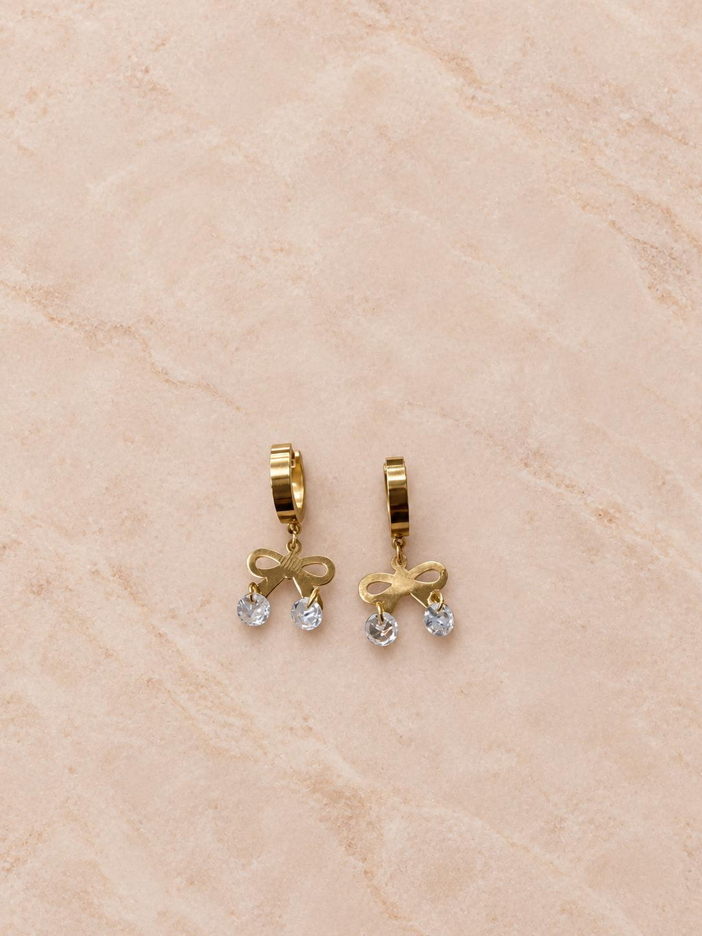 Aretes de aro dorados con moño y colgantes transparentes para mujer