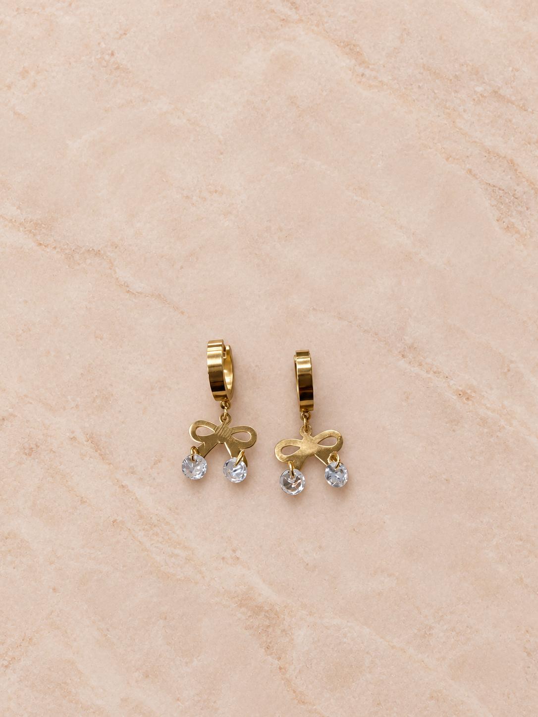 Aretes de aro dorados con moño y colgantes transparentes para mujer