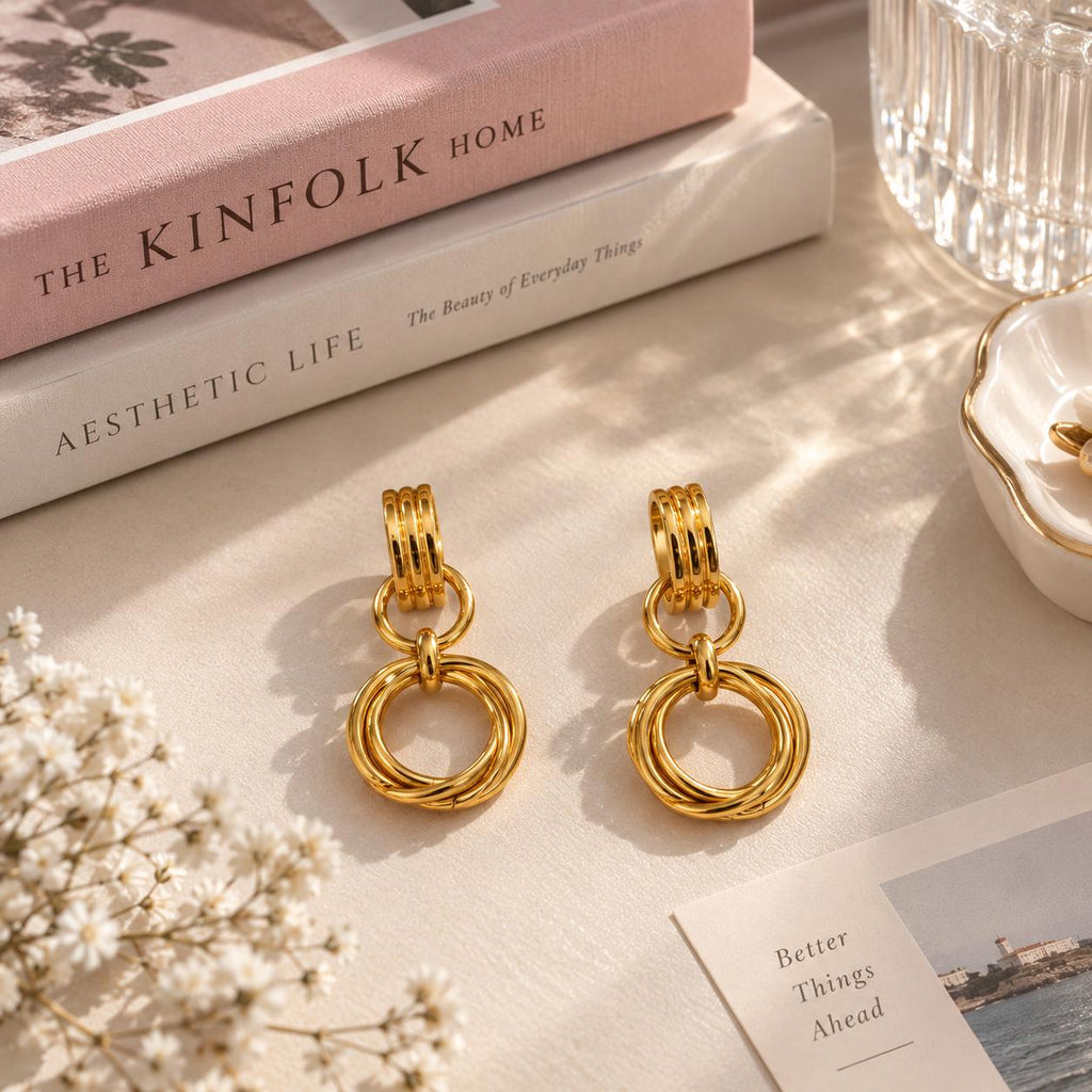 Aretes colgantes dorados para mujer con aros entrelazados, estilo elegante y moderno