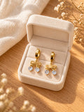 Aretes de aro dorados con moño y colgantes transparentes para mujer