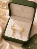 Pendientes dorados en forma de ala con circonias gota, diseño elegante para mujer SUY