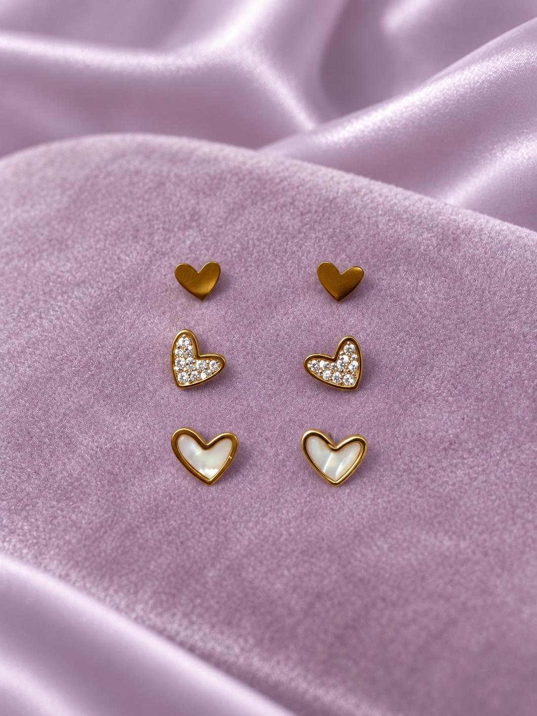 Set de 3 pares de aretes de corazón dorados para mujer, diseños lisos, brillantes y con efecto nacarado