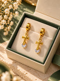 Aretes de aro dorados con cruz colgante y detalle brillante para mujer — 1 par